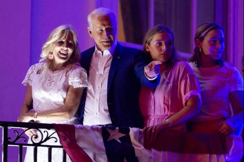 President Joe Biden (C) and First Lady Jill Biden (L), with granddaughters Finnegan Biden (2-R) and Naomi Biden (R) watch fireworks on the National Mall from the Truman balcony of the White House during a celebration of Independence Day in Washington, DC, on Sunday, July 4, 2021. File Photo by Michael Reynolds/UPI