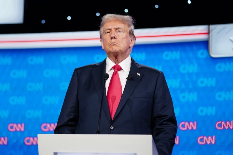 Former President Donald Trump stands on the stage during a break in the CNN presidential election debate with President Joe Biden in Atlanta on June 27. Photo by Elijah Nouvelage/UPI