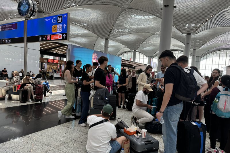 Passengers wait at Istanbul Airport in Istanbul, Turkey Friday amid a global IT outage caused by a cybersecurity update issued by Texas-based CrowdStrike. Photo by Tolga Bozoglu/EPA-EFE