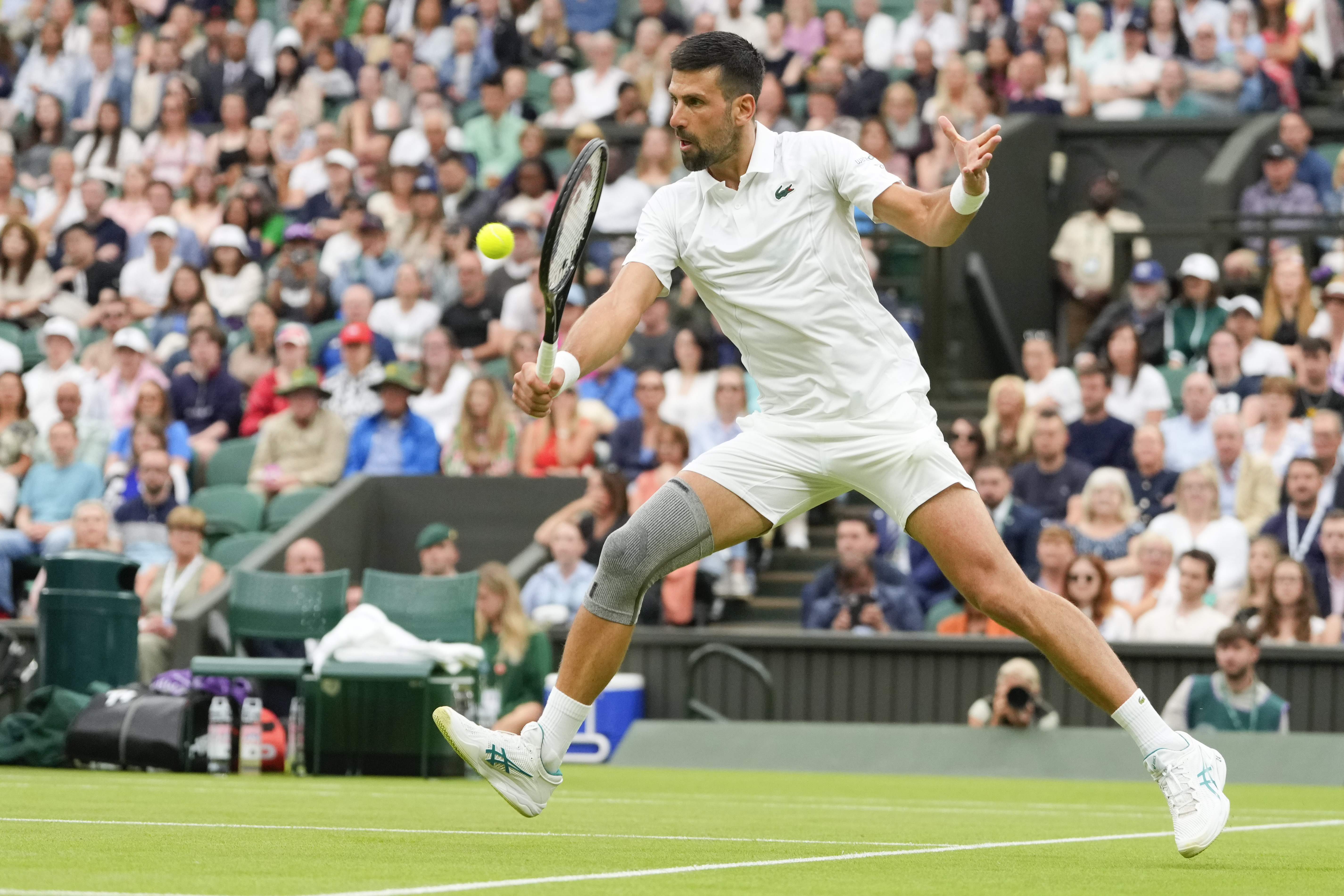 Novak Djokovic wore a grey knee brace for his first-round clash at Wimbledon 2024