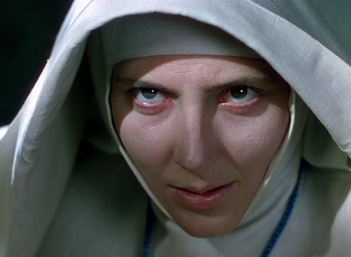 A nun stares ominously.