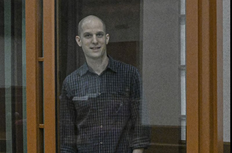 Wall Street Journal correspondent Evan Gershkovich stands in a glass cage before a hearing in Yekaterinburg's Sverdlovsk Regional Court, on June 26. 2024. He was sentenced to 16 years in prison on Friday. File Photo by Stringer/EPA-EFE