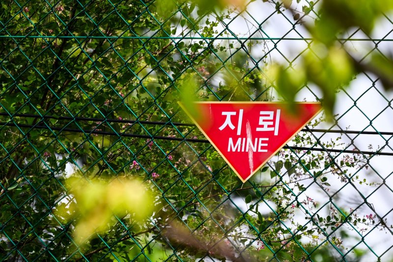 North Korea has laid tens of thousands of mines in the DMZ in recent months, Seoul's military said Wednesday. A sign warns of mines at Camp Greaves inside the Civilian Control Zone of the DMZ near Paju. File Photo by Thomas Maresca/UPI