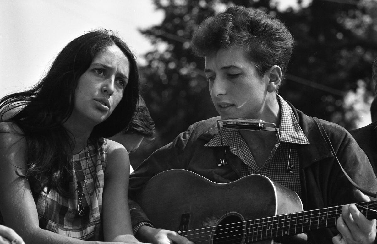 Joan Baez and Bob Dylan perform during a 1963 civil rights rally in Washington, D.C.