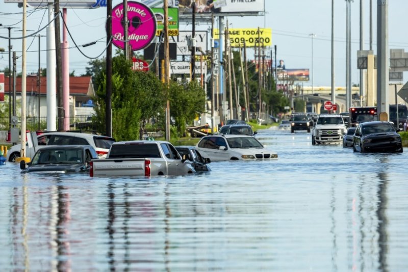 Vehicles trapped in flood waters following heavy rain from Hurricane Beryl in Houston, July 8, 2024. The storm, which caused widespread damage in the Caribbean, was downgraded to a tropical storm as it passed over the Gulf of Mexico before regaining strength into a hurricane. EPA-EFE/CARLOS RAMIREZ