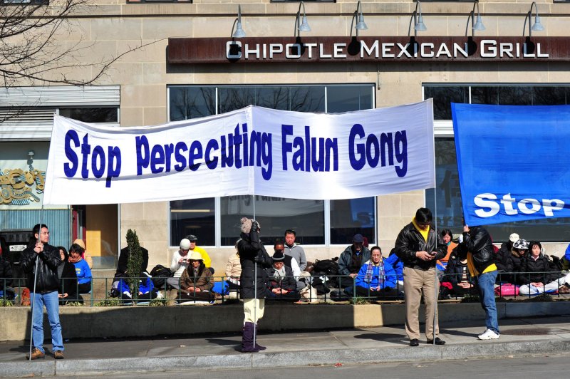 Falun Gong supporters protest against China outside of the Marriott Wardman Park Hotel in Washington, D.C., in 2012. On Thursday, two men pleaded guilty for forwarding a Beijing-backed scheme targeting Falun Gong practitioners in the United States. Photo by Kevin Dietsch/UPI