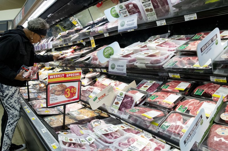 A customer looks at meat products at a Safeway supermarket, a subsidiary of Albertsons, in Washington, D.C. on October 27, 2022. The Bureau of Labor Statistics said the producer price index increased faster than expected in June. File Photo by Michael Reynolds/EPA-EFE