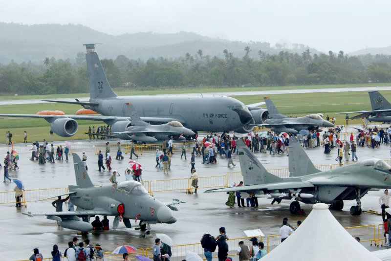 A KC-135 tanker from the 909th Air Refueling Squadron, Kadena Air Base, Japan, and F-16 fighter aircraft from the 35th Fighter Squadron, Misawa Air Base, Japan, are seen here in 2003. The Pentagon on Wednesday announced it will be deploying 48 F-35A Lightning II fighter jets to the base as part of a multi-year modernization plan. File Photo by Val Gempis/AFIE/UPI