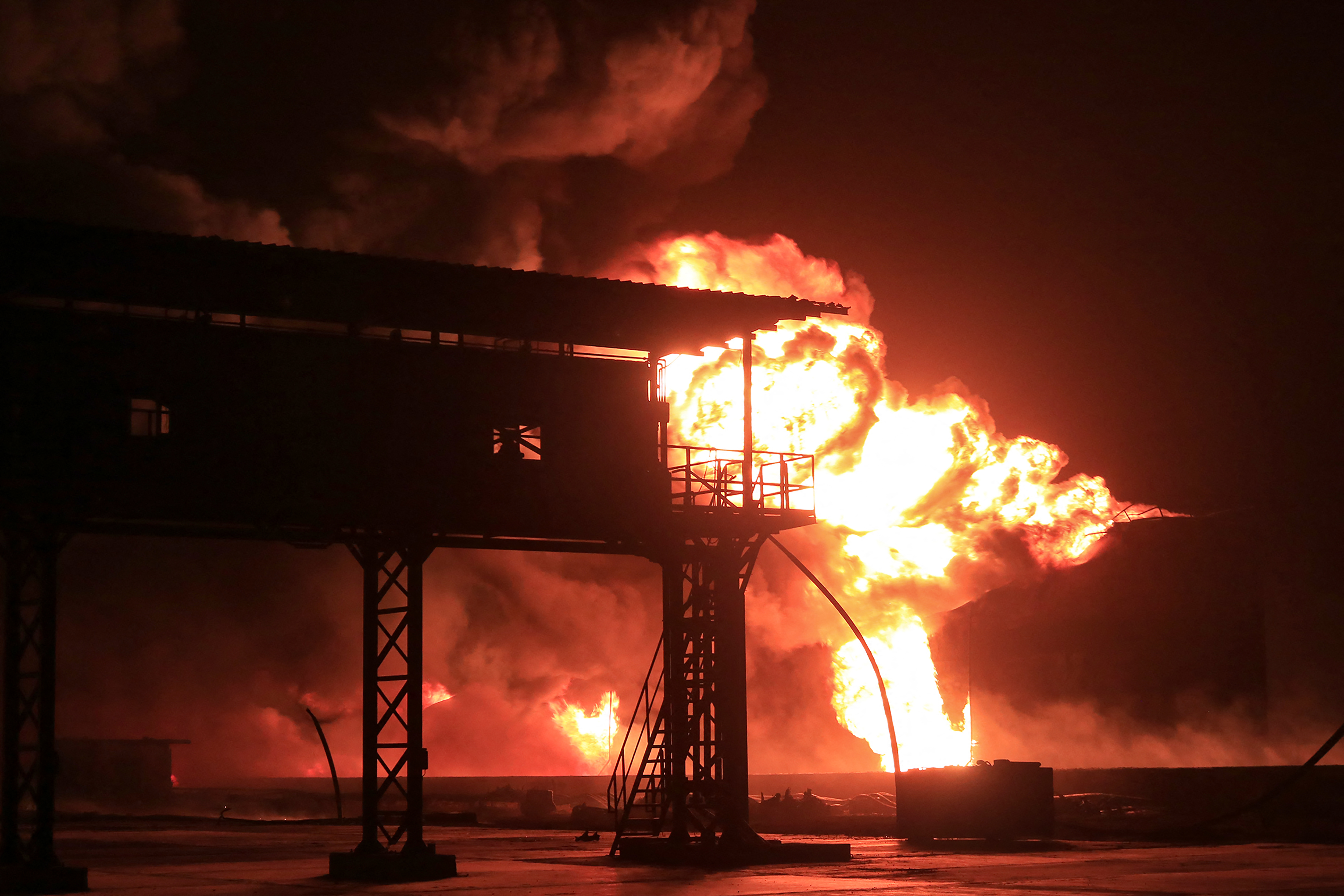 A giant fire erupts at an oil storage facility following Israeli strikes in Yemen’s Huthi-held port city of Hodeida on July 20