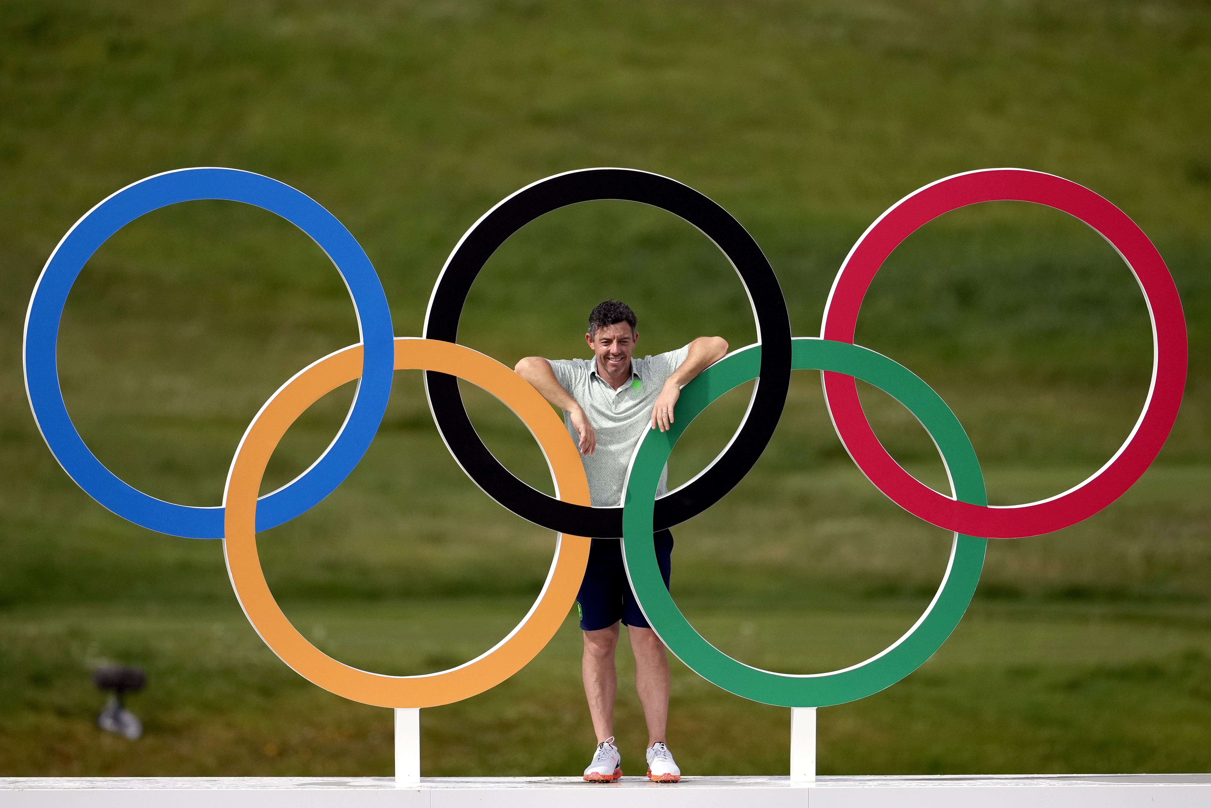 Rory McIlroy posing under the Olympic rings at Paris 2024