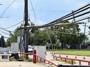 FILE - Utility polls wait for repair after being damaged by Hurricane Beryl in Houston, July 10, 2024. Destructive storms like Hurricane Beryl that knocked out power to 3 million homes and businesses in Texas are growing more frequent and intense, and insurers are jacking up rates in response.