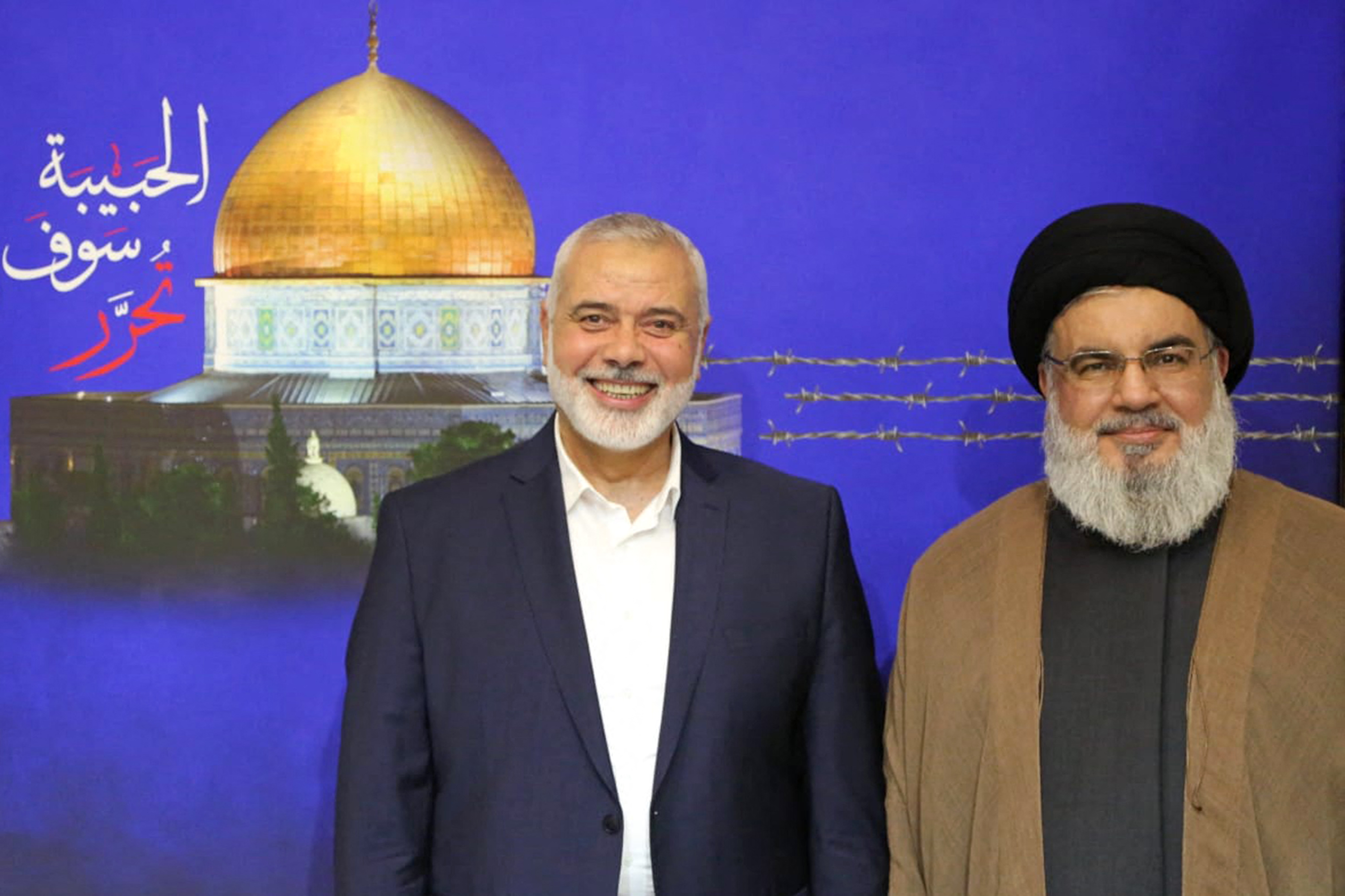 Hezbollah Hasan Nasrallah (R) posing for a picture with Ismail Haniyeh (L)