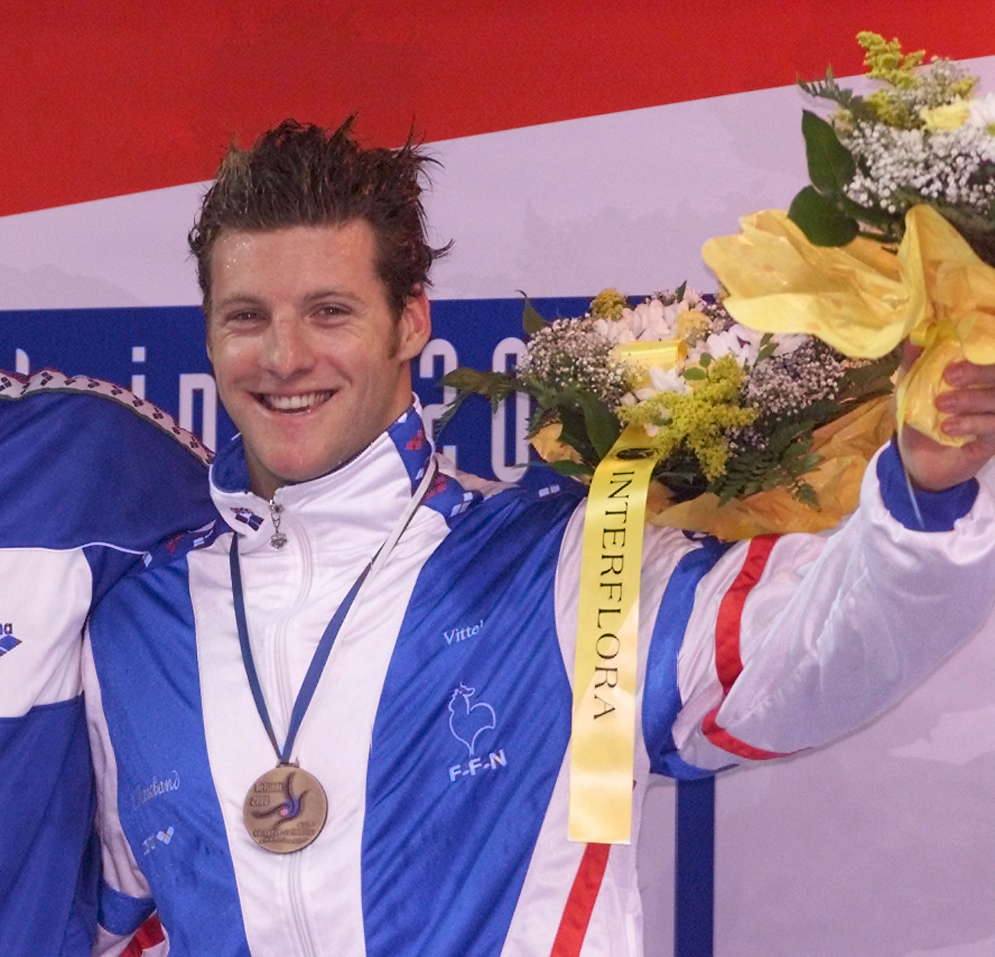 Xavier Marchand celebrating with his bronze medal at the European Swimming Championships 2000