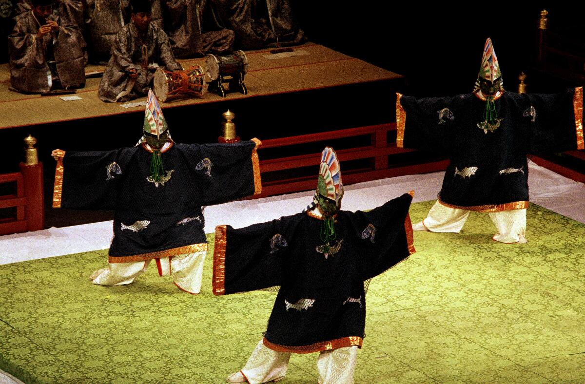 Japanese dancers in traditional costumes perform July 20, 1984, as part of the Olympic Arts Festival in Los Angeles.