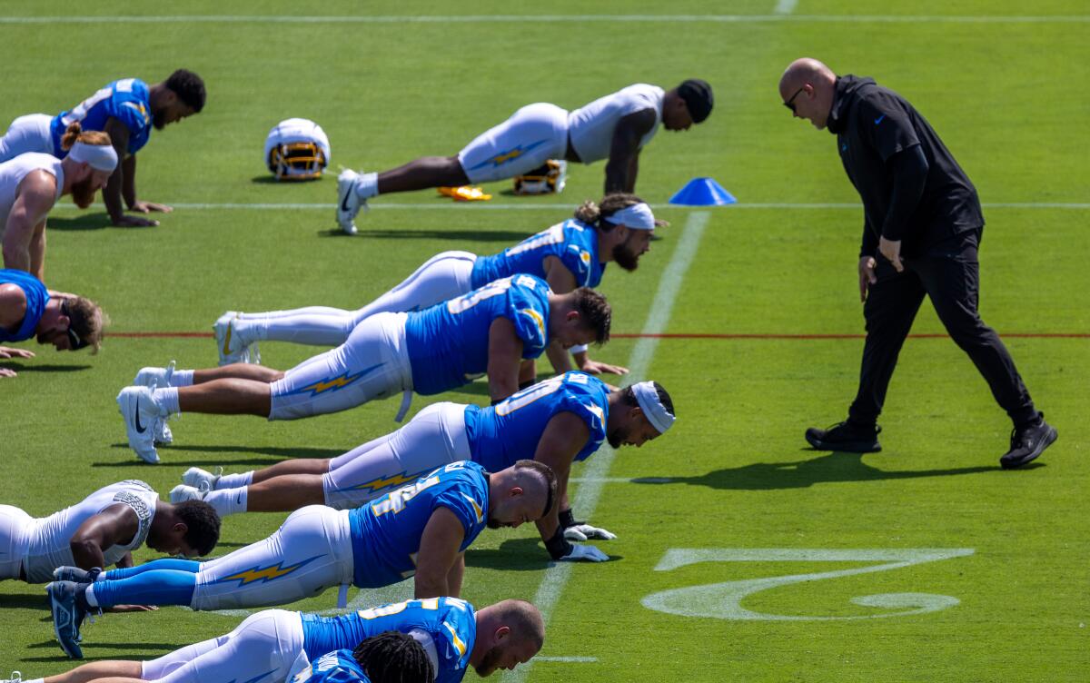 A coach belts out instructions at Chargers players.