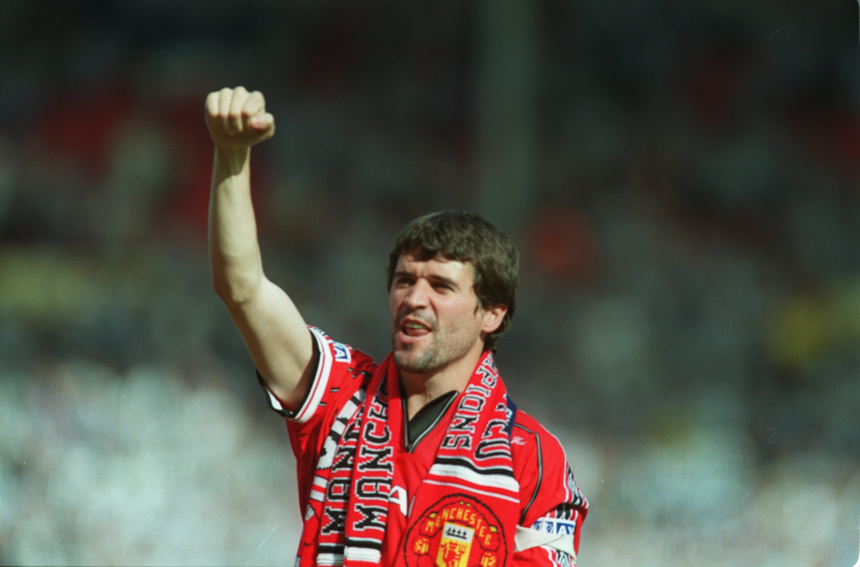 Manchester United captain Roy Keane celebrates winning the FA Cup