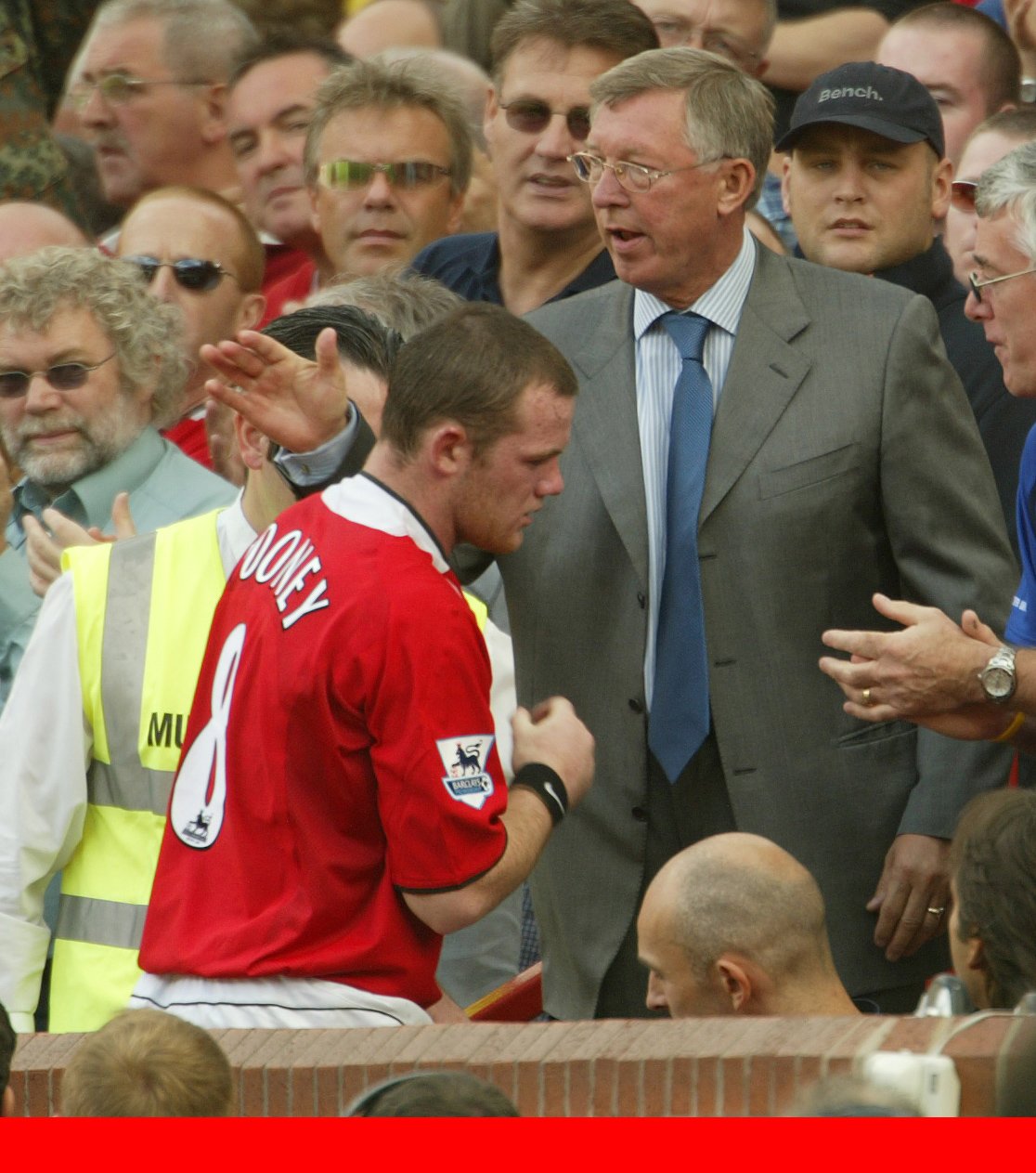 Ferguson shakes hands with Wayne Rooney as he comes off the pitch in 2005