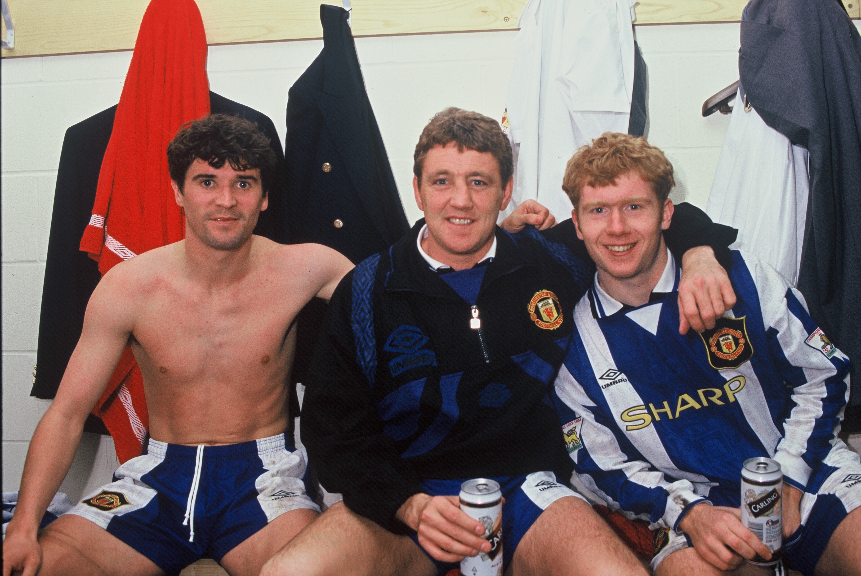 Roy Keane, Steve Bruce and Paul Scholes celebrate with a few cans in the dressing room