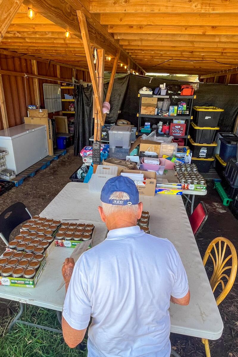 A man looks over items on a table