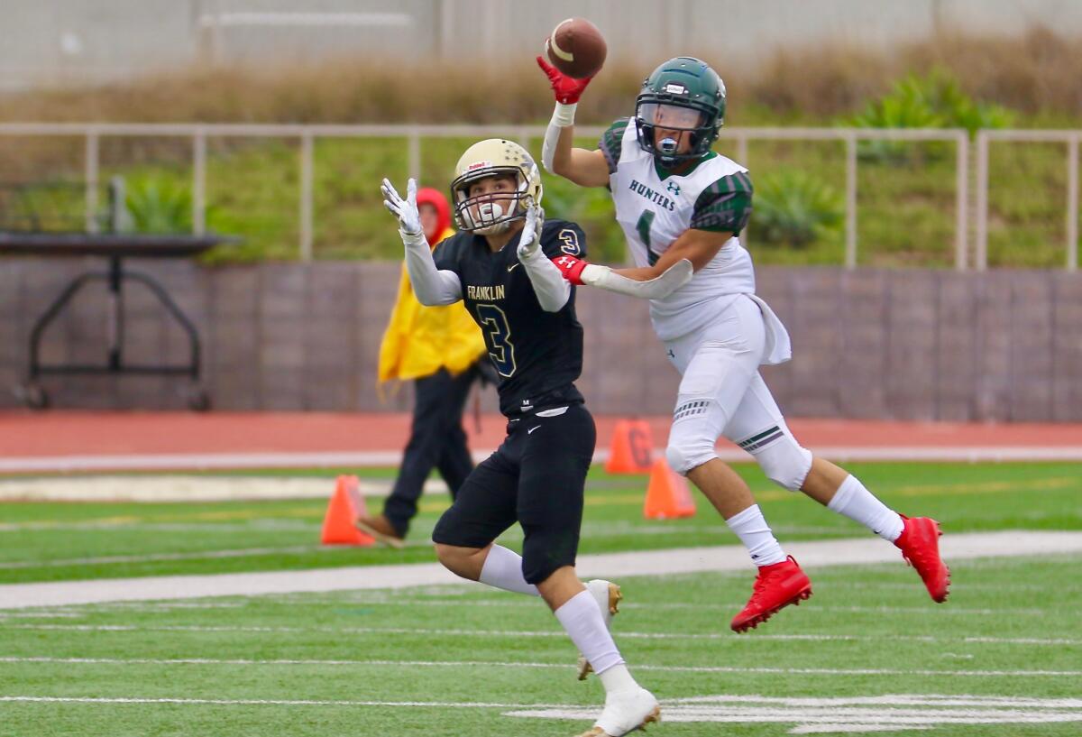 Canoga Park defensive back Dominic Arango-Serna breaks up a pass intended for Franklin wide receiver Chris Jauregui.