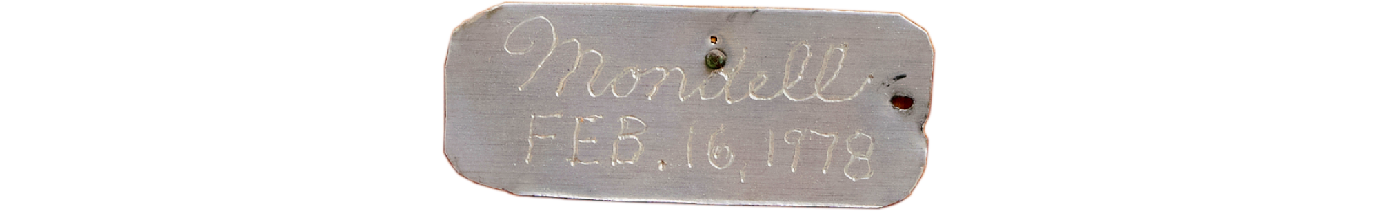 a metal tag that reads: “Mondell FEB. 16, 1978”