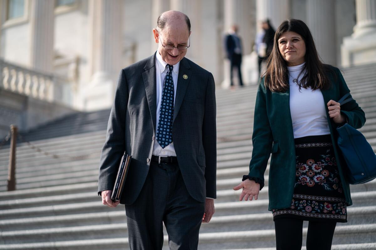 Brad Sherman and Haley Stevens walk down steps 