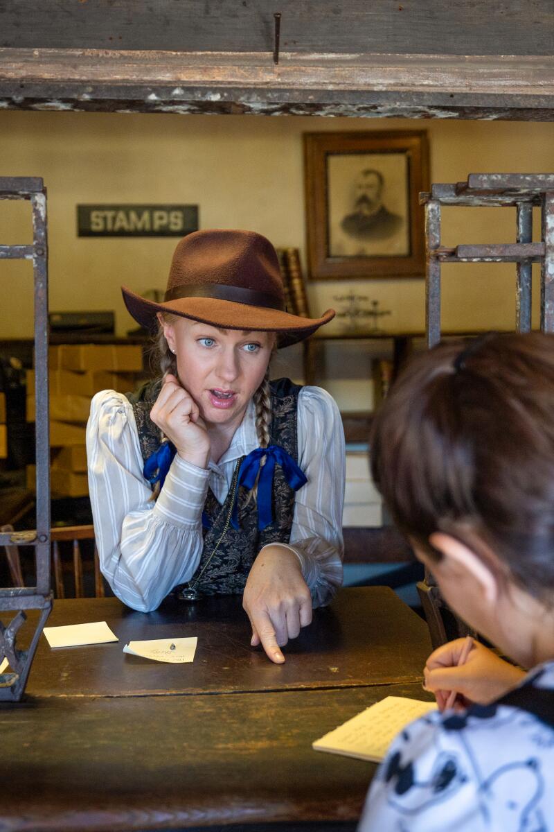 Annabelle Pancake, right, plays a Calico Gazette press reporter as she interviews Rachel Roman, left.