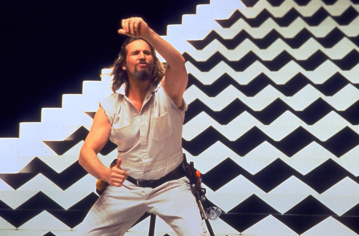 Jeff Bridges in front of black and white geometric design in a scene from "The Big Lebowski."