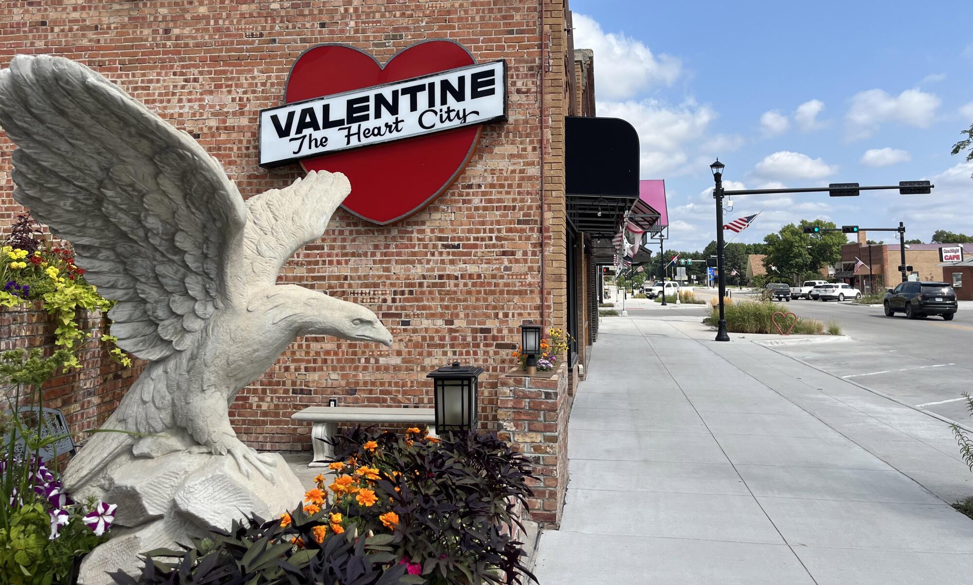 Downtown Valentine, Nebraska, with an eagle statue in foreground