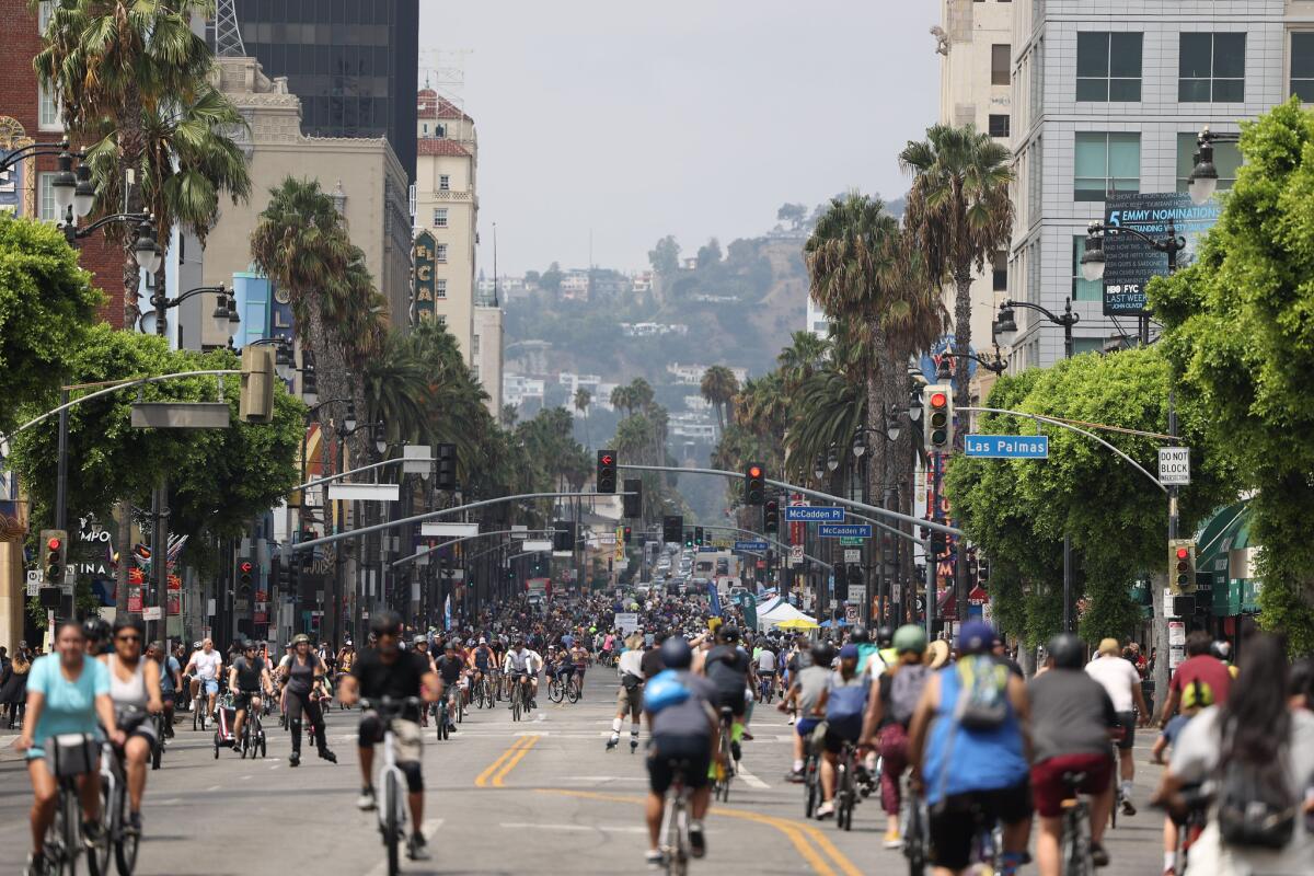 A wide Los Angeles Street filled with bikers.