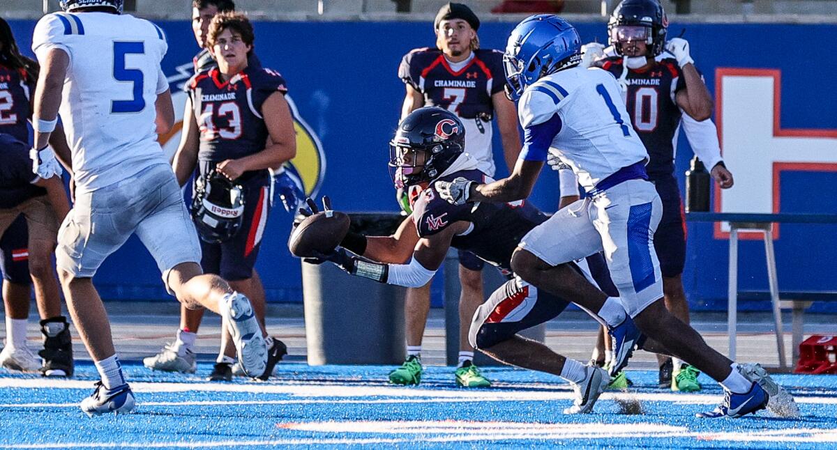 Devin Olmande of Chaminade makes diving catch in scrimmage against Santa Margarita.