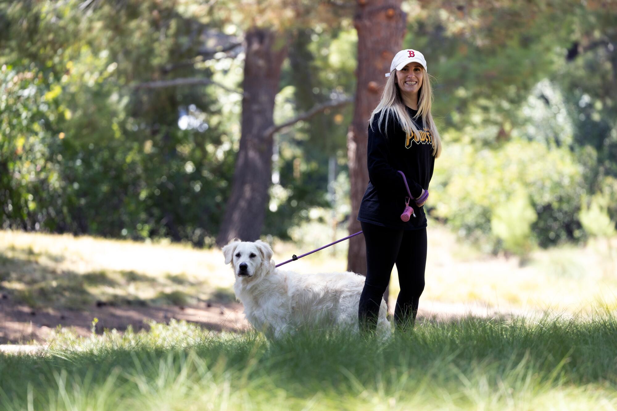 Kim Pohas with her dog, Sasha, at the Jeffrey Open Space Trail in Irvine.