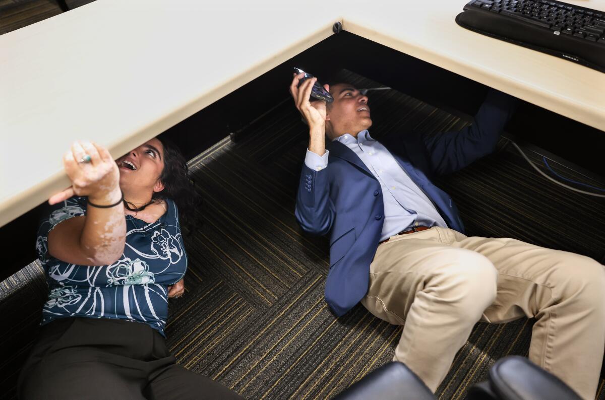 Rep. Robert Garcia, right, visits current student government President Nikki Majidi.