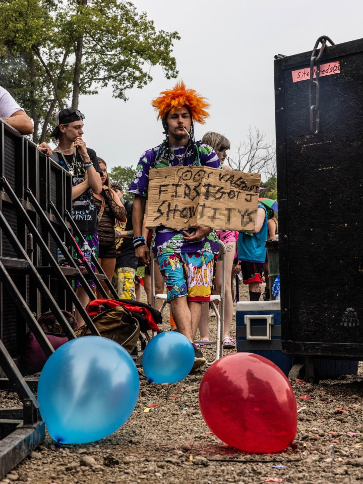 A man held a sign as he made his way to the wet t-shirt contest