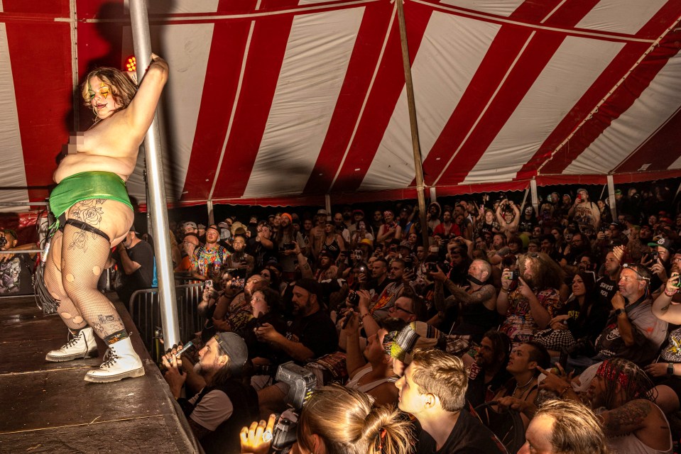 One woman was topless holding onto a pole during the Queen of Cheeks contest