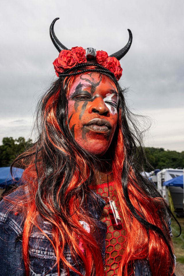 Someone named Mystic wore a red and black wig with horns that matched their makeup