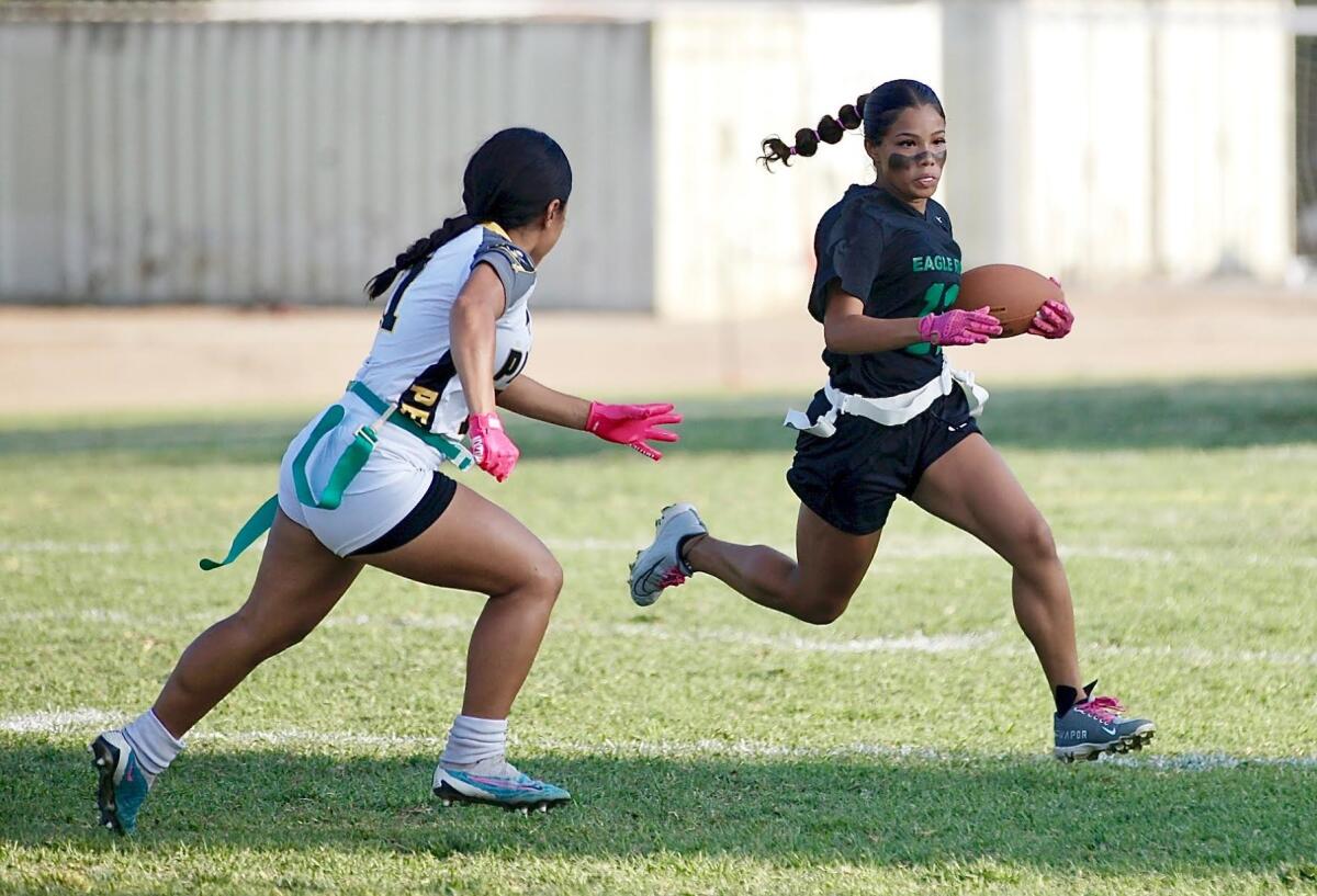 Eagle Rock's Haylee Weatherspoon runs with the ball as she tries to evade a defender during a game last season