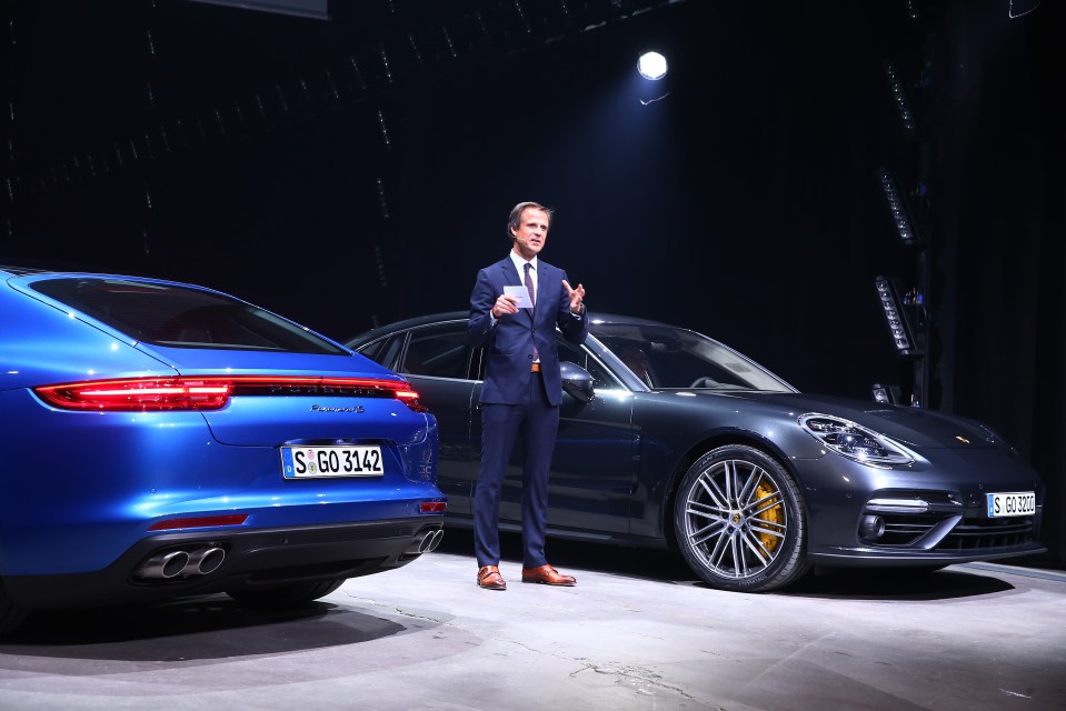 Chief designer Michael Mauer, pictured in 2016 alongside the Porsche Panamera