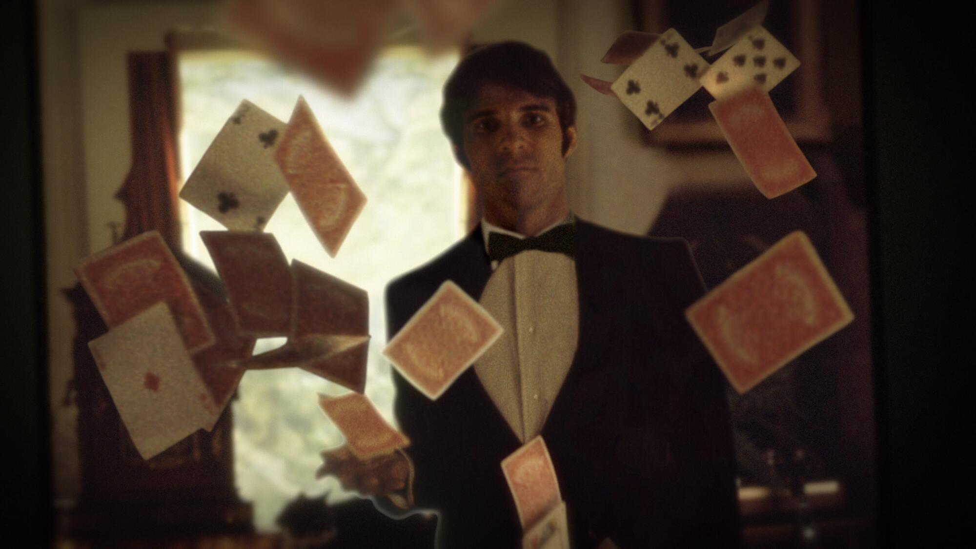 A young Steve Martin stands behind falling playing cards in "Steve! (Martin): A Documentary in 2 Pieces."