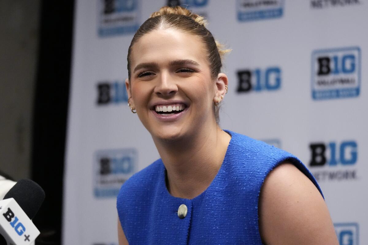 UCLA's Anna Dodson smiles as she listens to questions during 2024 Big Ten Volleyball Media Day