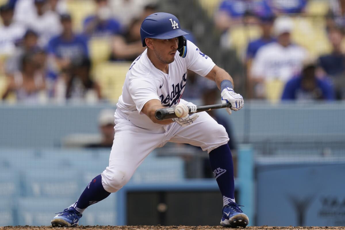 Austin Barnes puts down a bunt during a game against the Miami Marlins on Aug. 19, 2023.