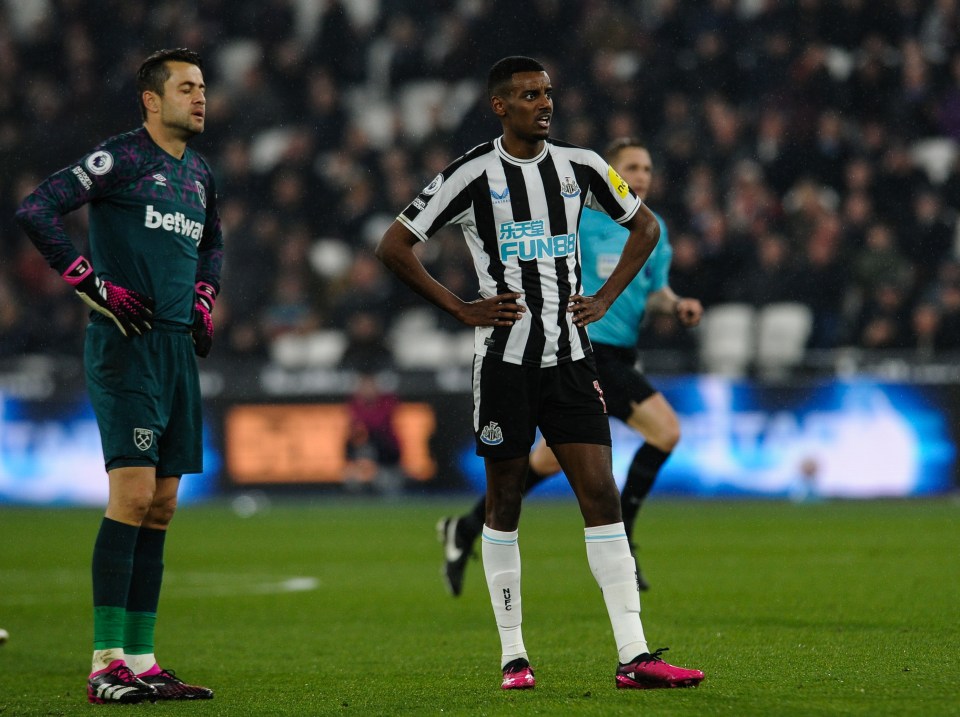 A dejected Lukasz Fabianski looks on as Isak nets a ball past him