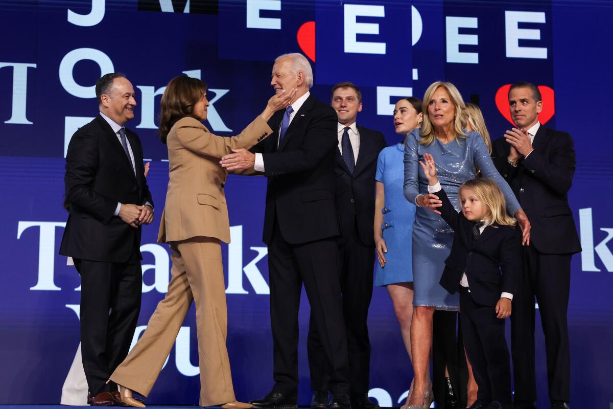 Vice President Kamala Harris embraces President Biden after his speech at the Democratic National Convention.