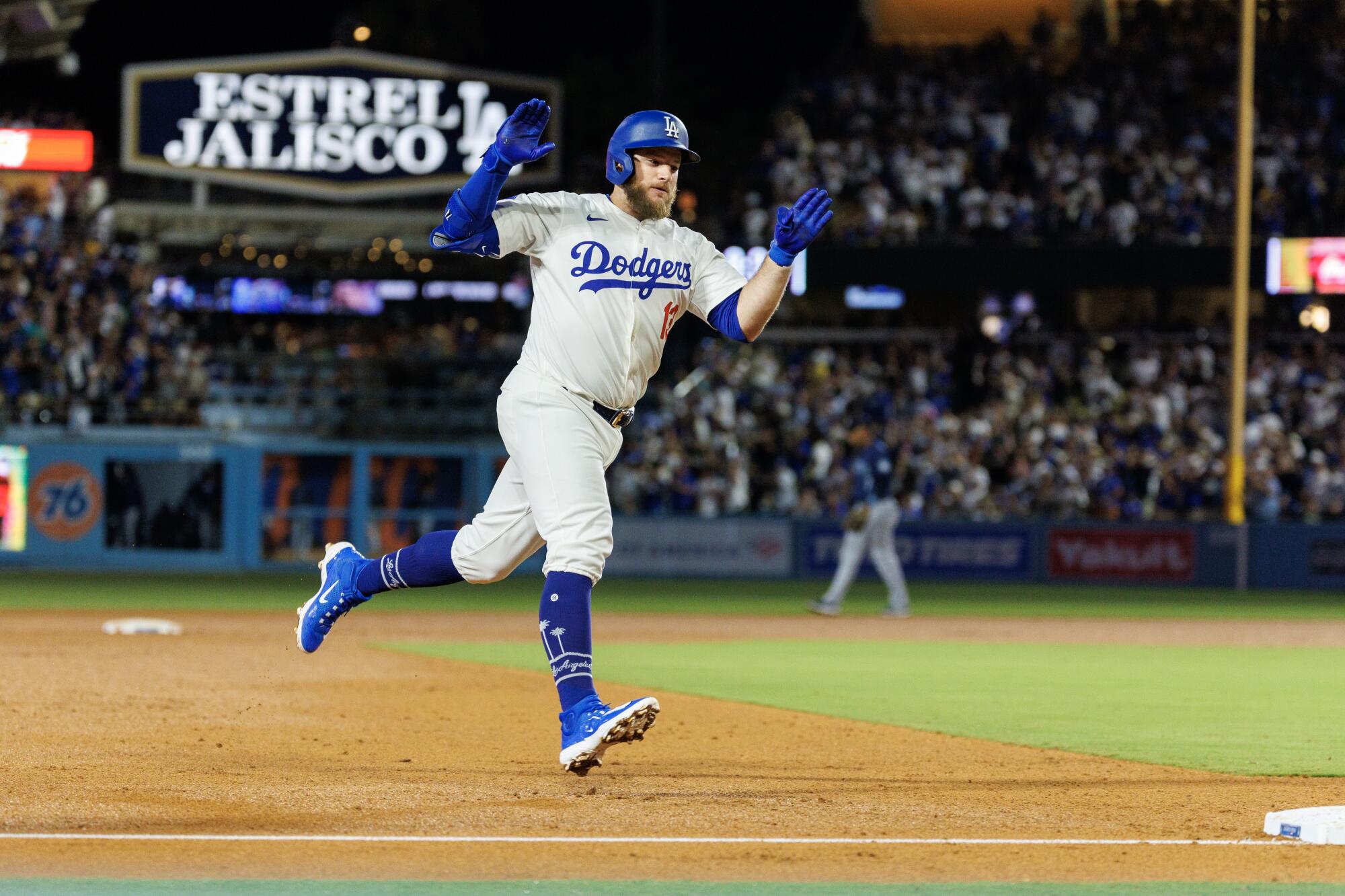 Dodgers third baseman Max Muncy celebrates after hitting a home run against the Seattle Mariners on Tuesday.