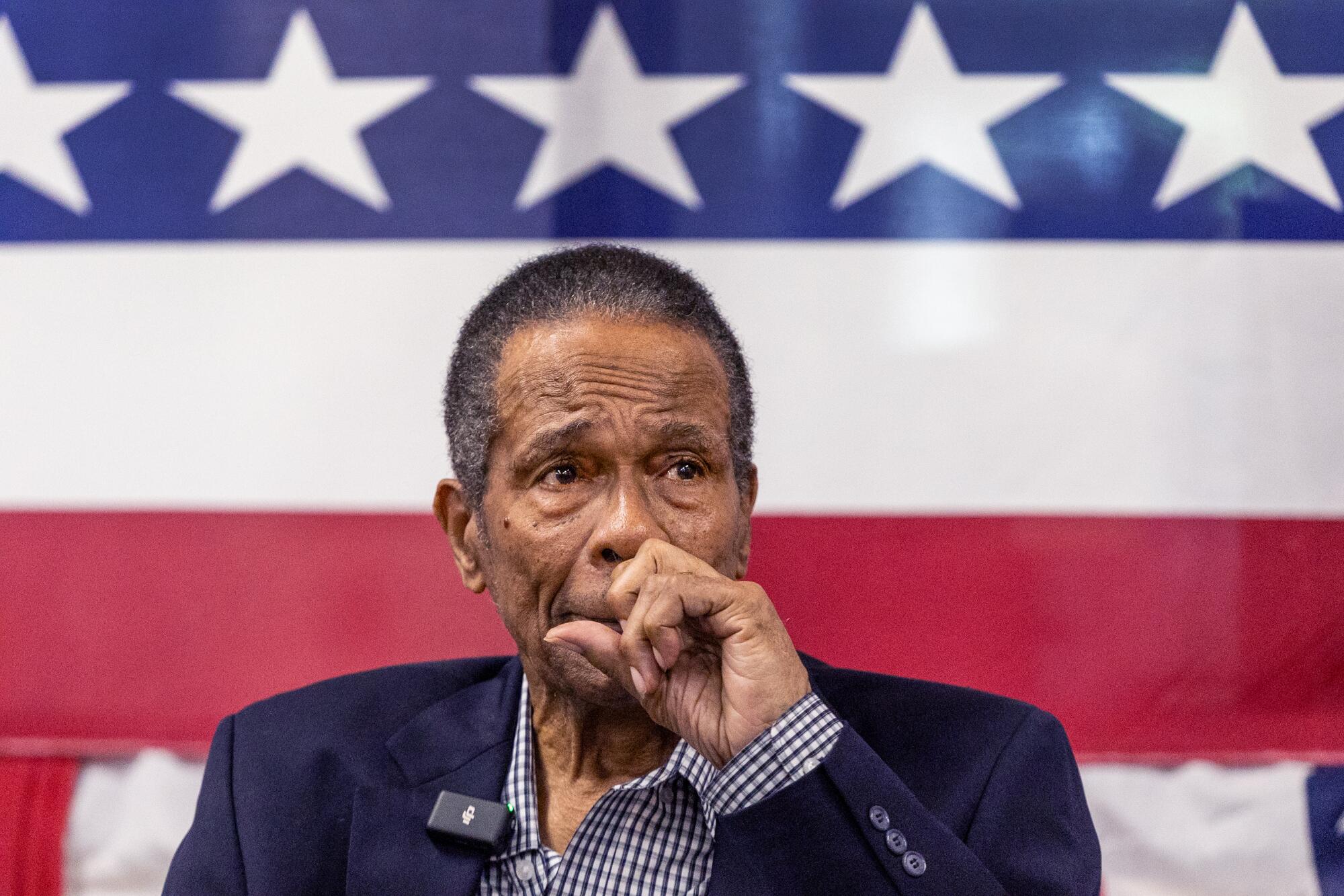 Rod Carew gets emotional as he watches an inspirational video during his naturalization ceremony on Friday in Santa Ana.