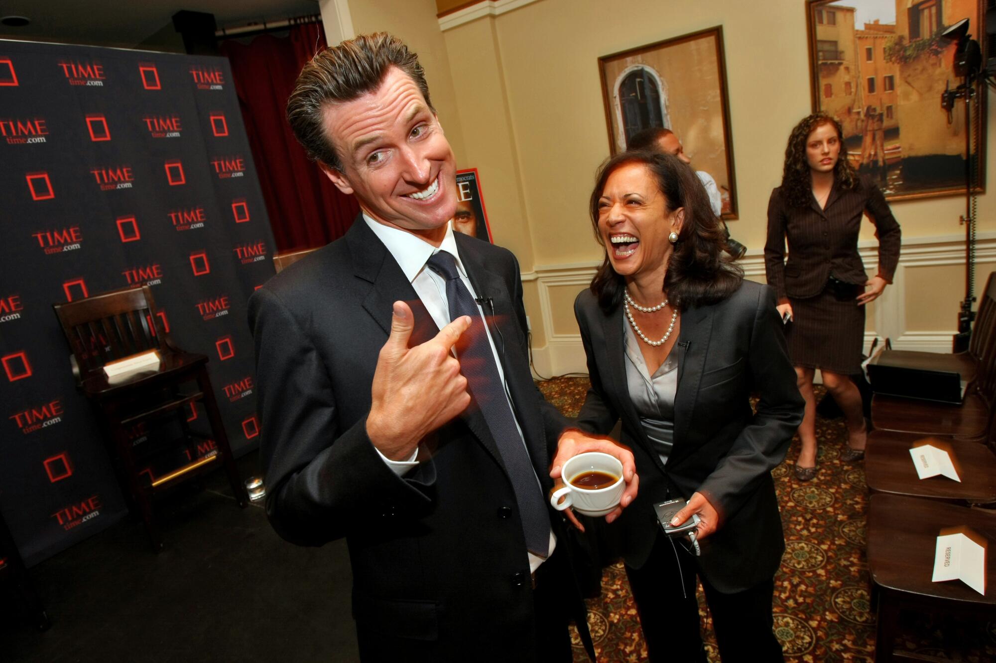 Gavin Newsom and Kamala Harris laugh at an event for up- and-coming politicians in 2008