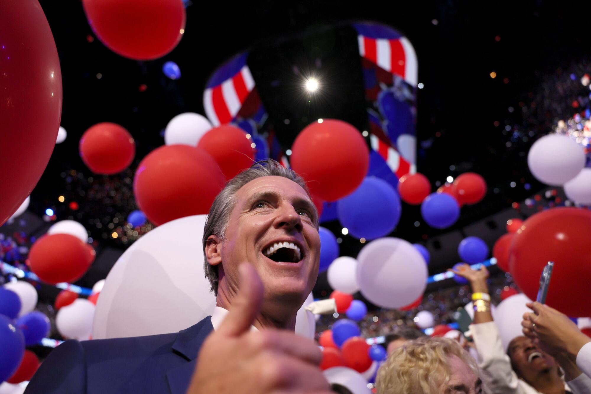 Balloons drop around Gov. Gavin Newsom as the Democratic National Convention ended on Thursday.