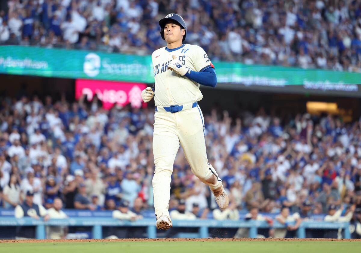 Dodgers star Shohei Ohtani scores a run against the Tampa Bay Rays in the fourth inning Saturday.