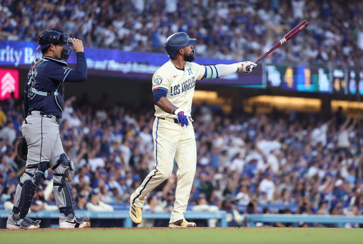 Teoscar Hernández hits a two-run home run against the Rays in the fourth inning Saturday.