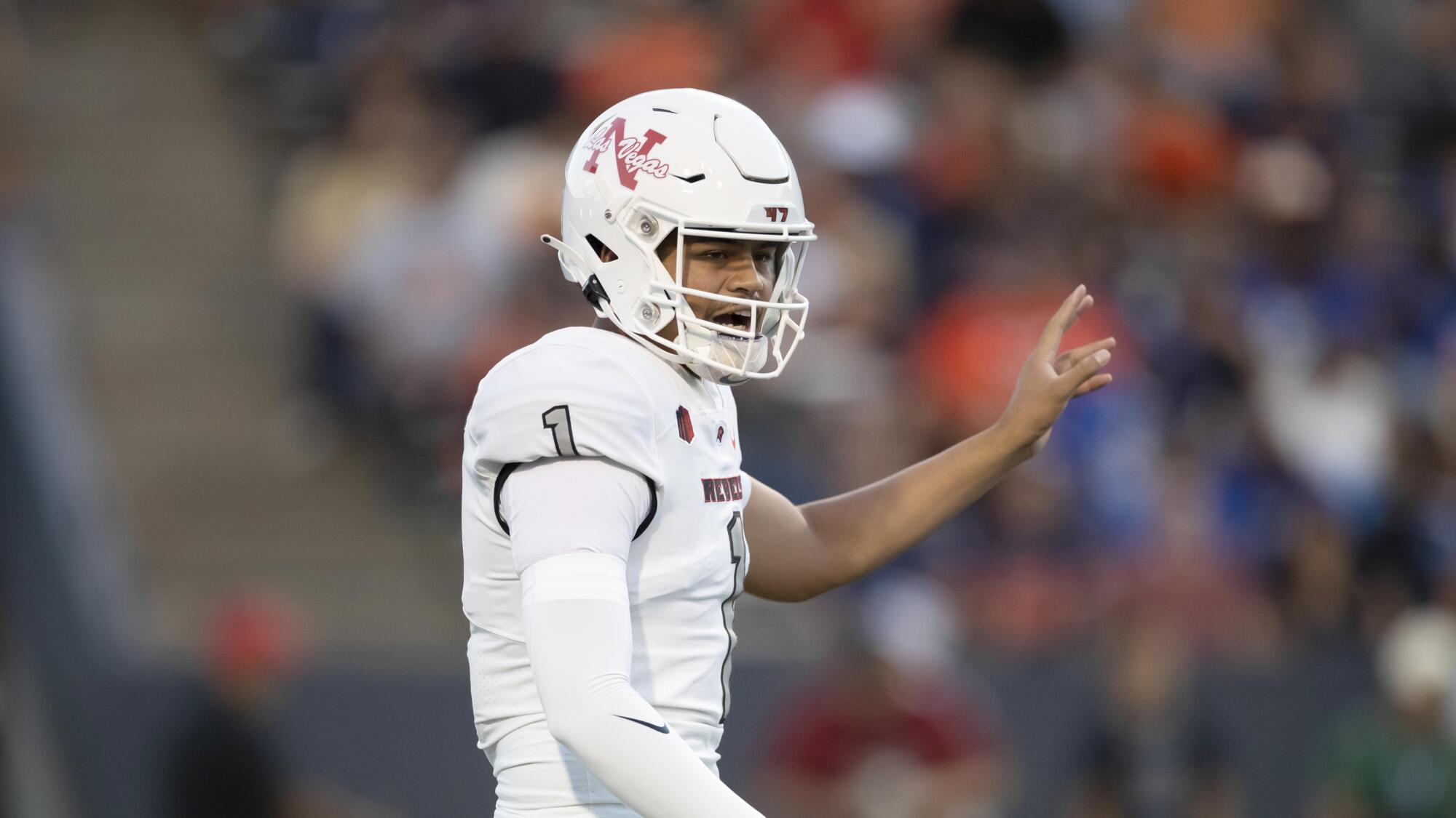 UNLV quarterback Jayden Maiava shouts instructions to his teammates before a snap last season.